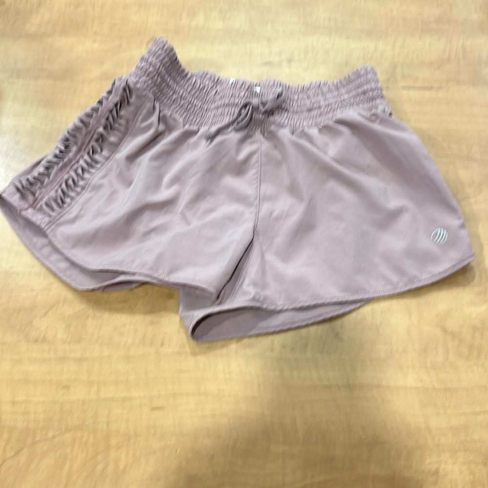 Ladies size small MPG running shorts in a blush rose color